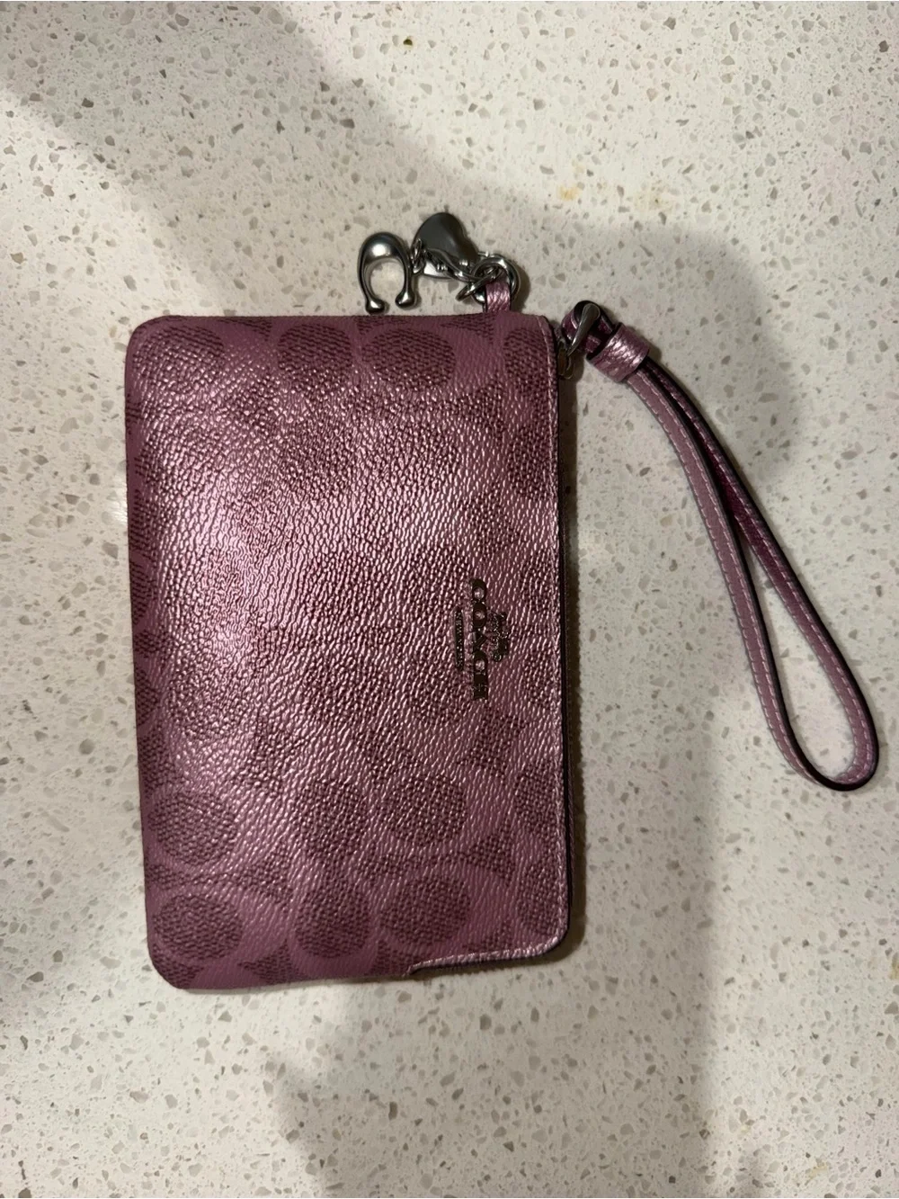 Metallic pink coach wristlet